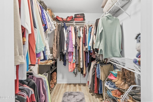 walk in closet featuring light wood-style floors