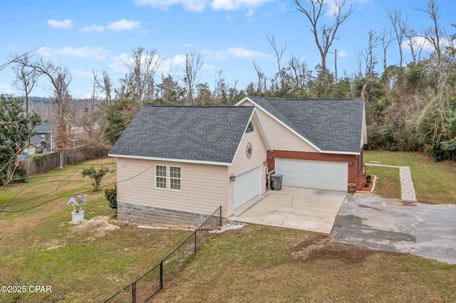 exterior space featuring a garage, a shingled roof, fence, driveway, and a lawn