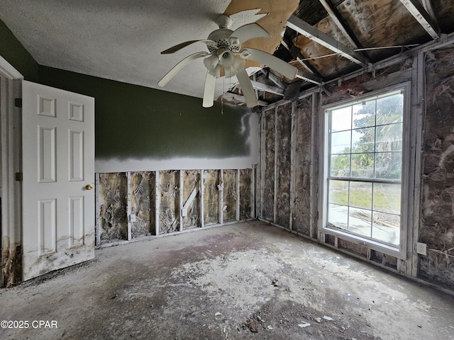 unfurnished room featuring a ceiling fan