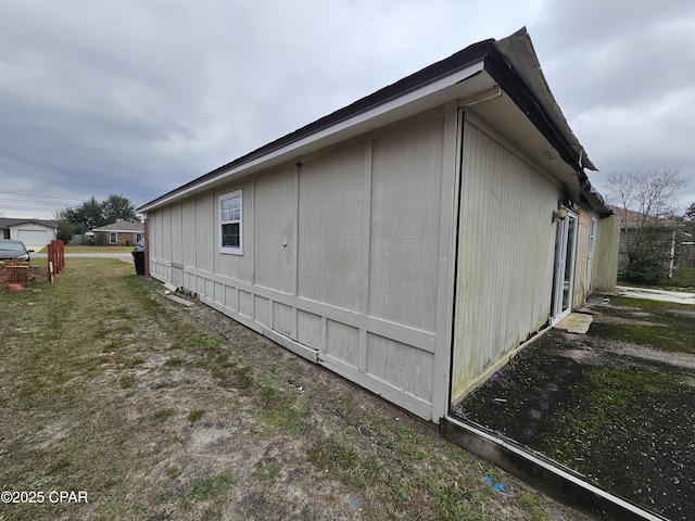 view of home's exterior with a lawn