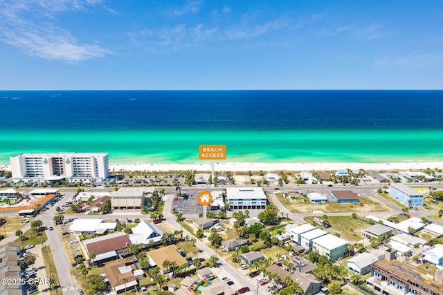 birds eye view of property featuring a water view and a view of the beach