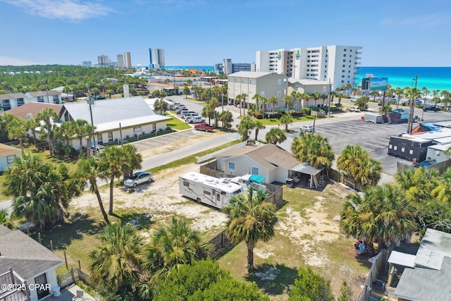 birds eye view of property featuring a city view and a water view