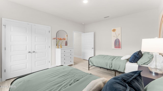 108 Walkabout Ct, Port St Joe, FL 32456 - bedroom featuring light wood-style floors, a closet, and baseboards
