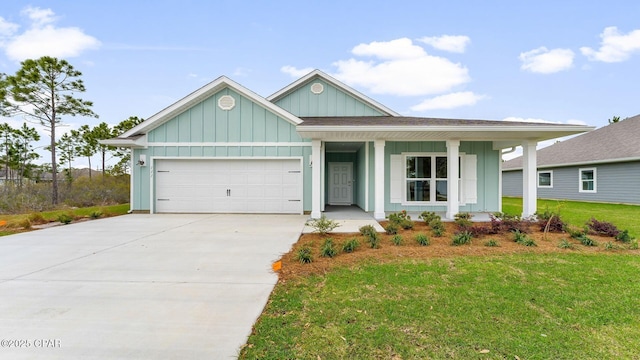 108 Walkabout Ct, Port St Joe, FL 32456 - single story home with a porch, board and batten siding, driveway, an attached garage, and a front lawn