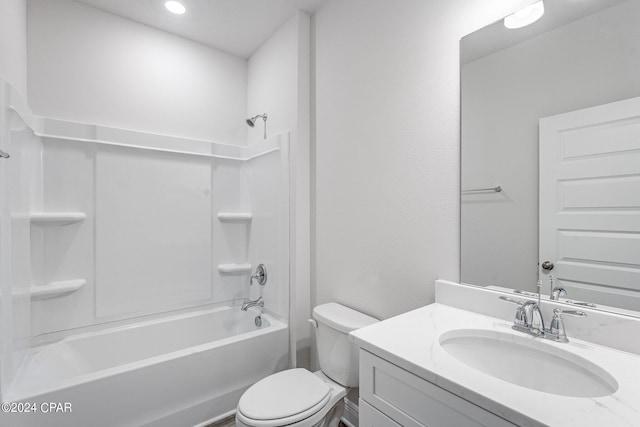 full bath featuring vanity, bathtub / shower combination, and toilet