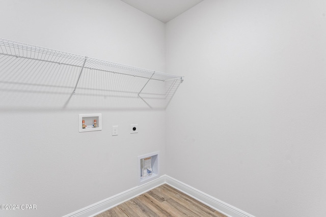 washroom with laundry area, washer hookup, wood finished floors, baseboards, and electric dryer hookup