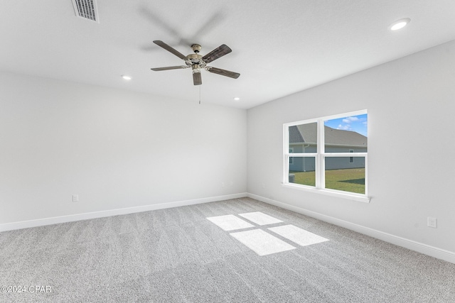 unfurnished room with recessed lighting, visible vents, light carpet, ceiling fan, and baseboards