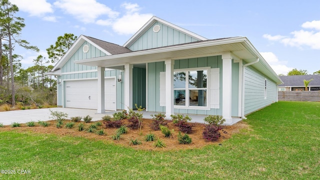 110 Crane Dr, Port St Joe, FL 32456 - view of front of property featuring board and batten siding, covered porch, concrete driveway, and a garage