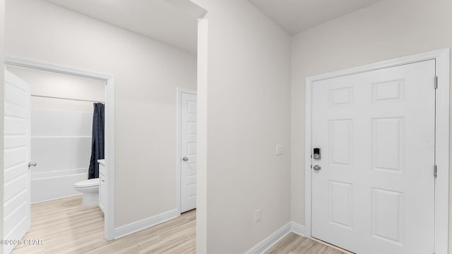 110 Crane Dr, Port St Joe, FL 32456 - entryway with light wood-style flooring and baseboards
