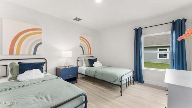 110 Crane Dr, Port St Joe, FL 32456 - bedroom featuring light wood-style flooring and baseboards