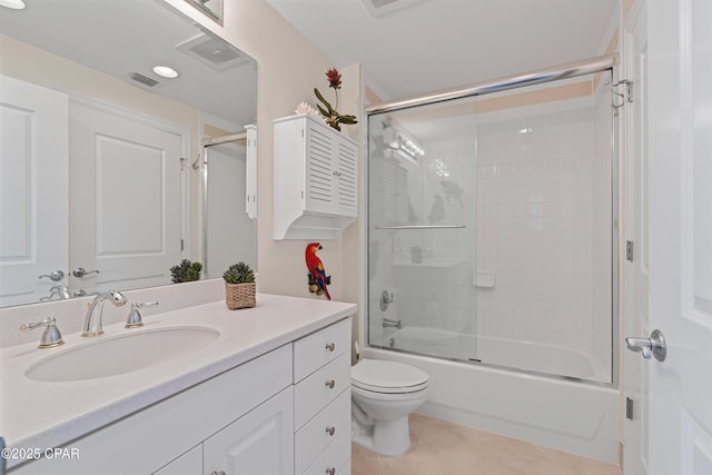 full bath featuring shower / bath combination with glass door, visible vents, toilet, vanity, and tile patterned flooring