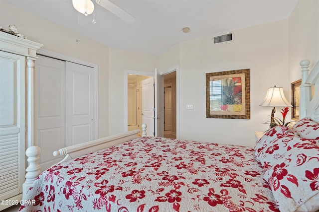 bedroom with ceiling fan, visible vents, and a closet