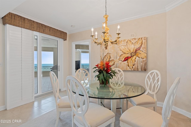 dining area with light tile patterned flooring, crown molding, a water view, baseboards, and an inviting chandelier