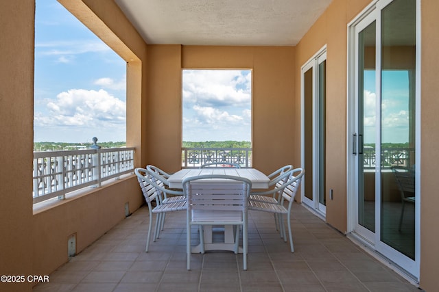 balcony with outdoor dining area