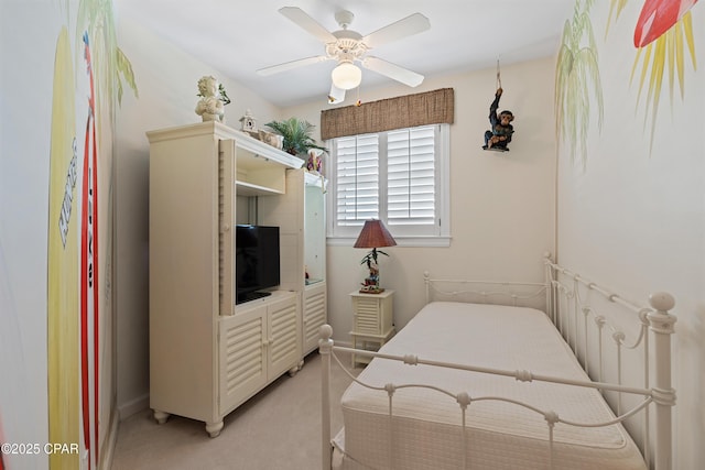 bedroom with ceiling fan and light colored carpet