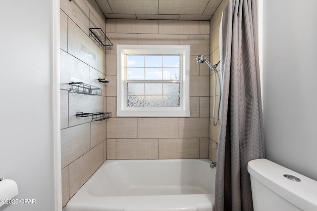 bathroom featuring shower / tub combo with curtain and toilet
