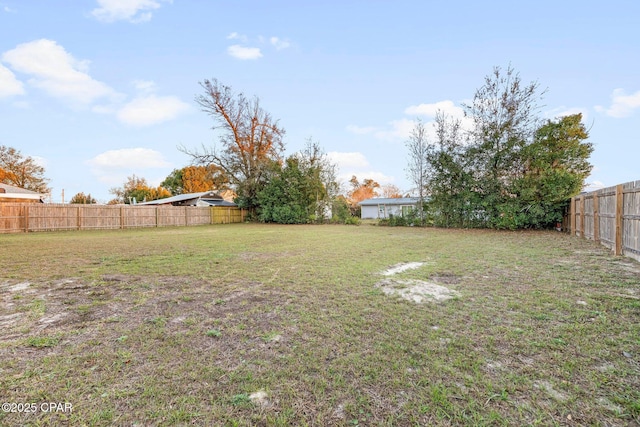 view of yard featuring a fenced backyard