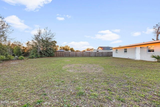 view of yard featuring fence