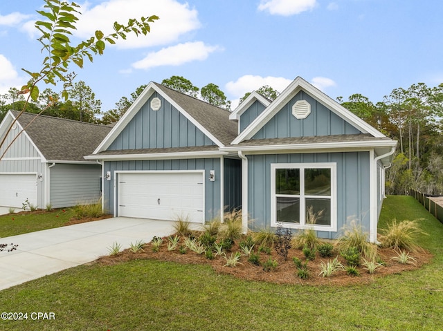 view of front facade with driveway, a front lawn, board and batten siding, and an attached garage