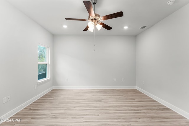 unfurnished room featuring recessed lighting, visible vents, ceiling fan, light wood-type flooring, and baseboards