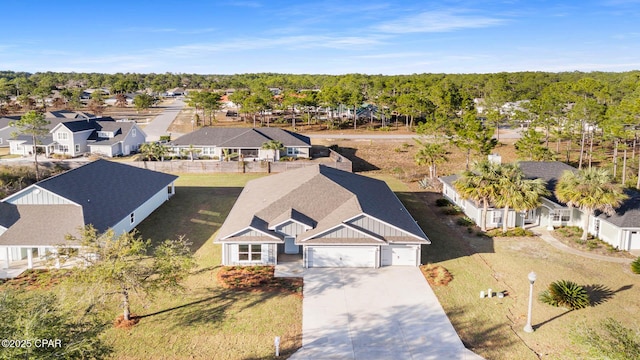 birds eye view of property with a residential view