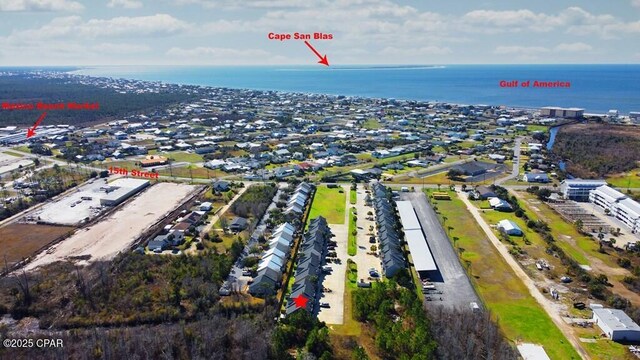 birds eye view of property with a water view