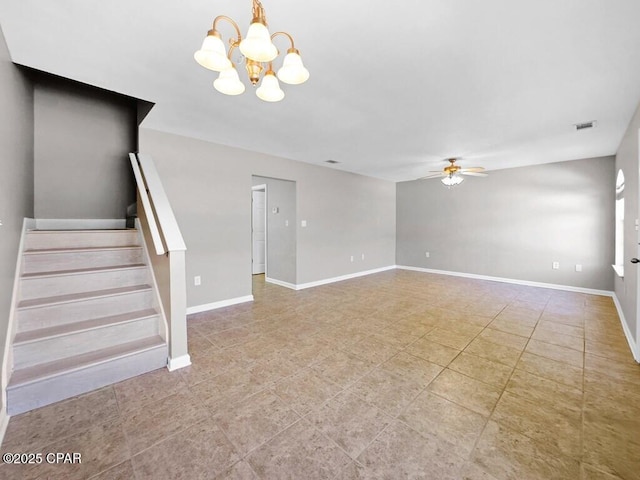 unfurnished living room with ceiling fan with notable chandelier, visible vents, baseboards, and stairs