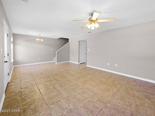 spare room featuring visible vents, stairs, baseboards, and ceiling fan with notable chandelier