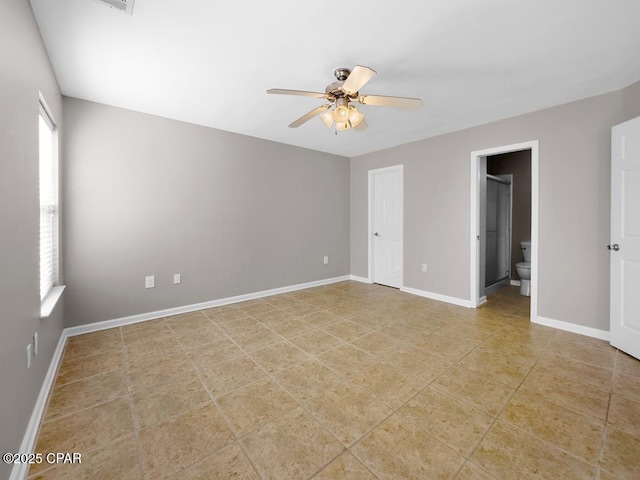 unfurnished room featuring tile patterned flooring, baseboards, and a ceiling fan