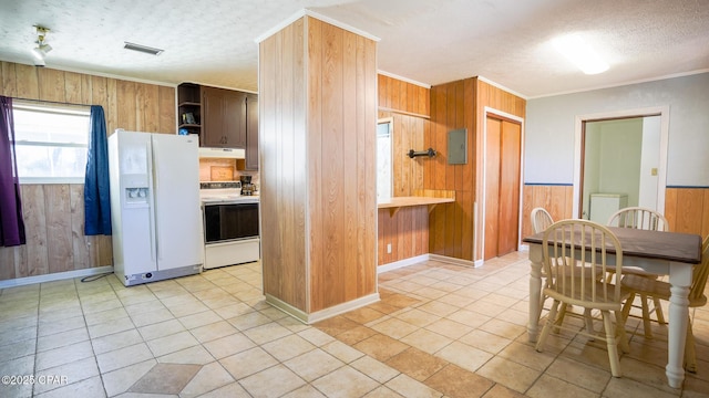 kitchen with under cabinet range hood, white appliances, visible vents, light countertops, and open shelves