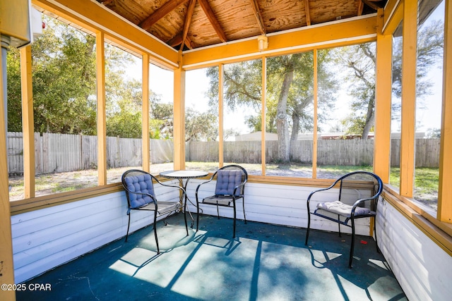 sunroom / solarium with lofted ceiling and wooden ceiling