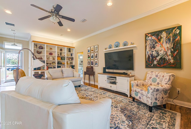 living area with baseboards, visible vents, ceiling fan, ornamental molding, and dark wood-type flooring