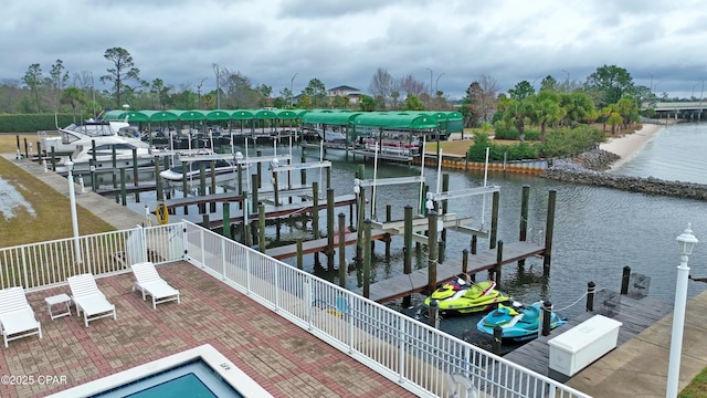 view of dock featuring a water view, boat lift, and fence