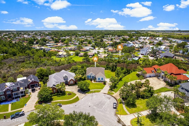 birds eye view of property with a residential view