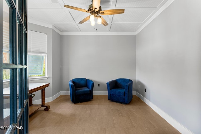 living area with ceiling fan, crown molding, and baseboards