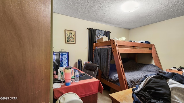 carpeted bedroom featuring a textured ceiling