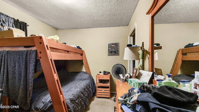 carpeted bedroom with a textured ceiling