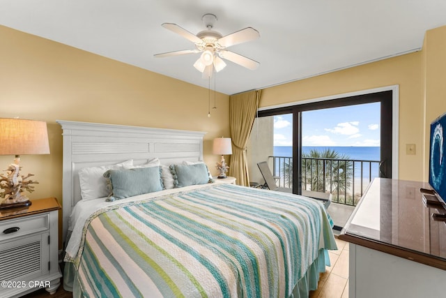 bedroom featuring ceiling fan, light tile patterned flooring, and access to exterior