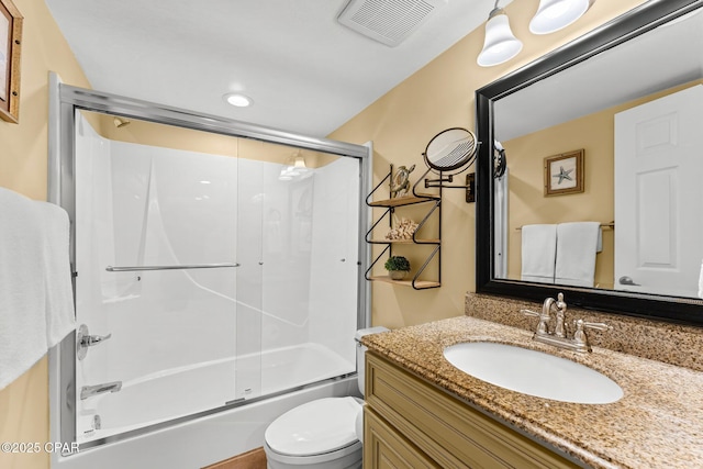 bathroom with enclosed tub / shower combo, toilet, recessed lighting, vanity, and visible vents