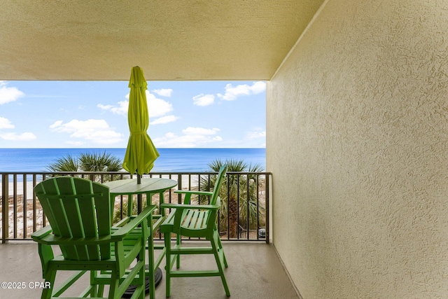 balcony featuring a water view