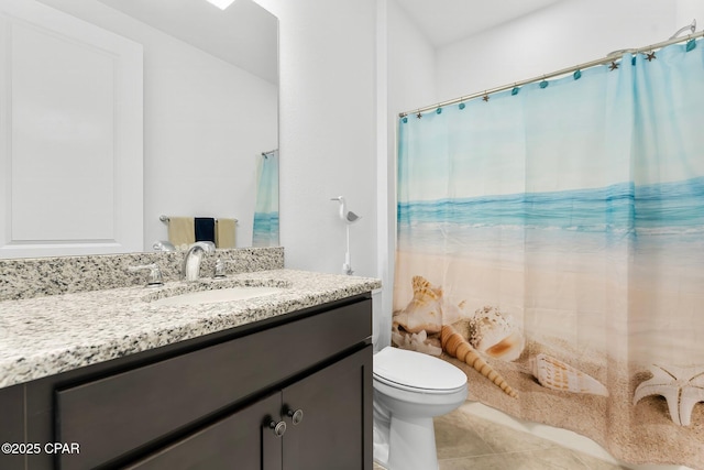 bathroom featuring vanity, tile patterned flooring, toilet, and curtained shower