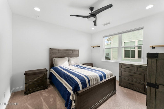 bedroom featuring light colored carpet, a ceiling fan, baseboards, recessed lighting, and visible vents