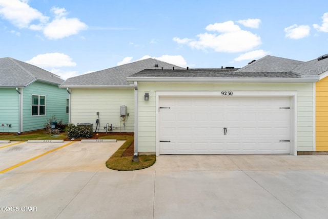 exterior space featuring roof with shingles