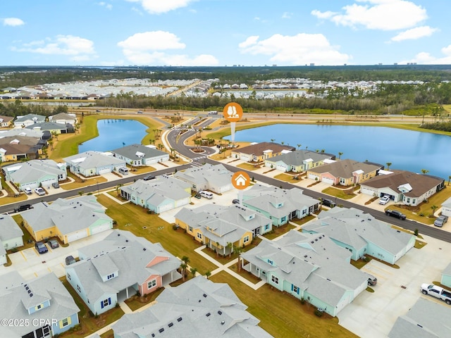 aerial view featuring a water view and a residential view