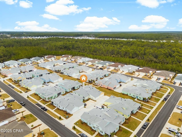 aerial view with a residential view and a wooded view