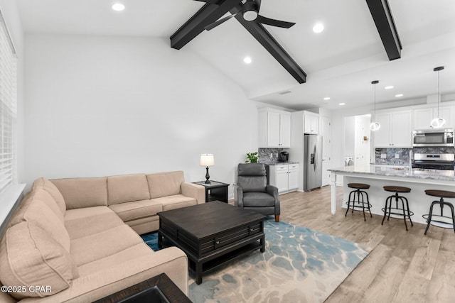 living room featuring light wood-style floors, a ceiling fan, lofted ceiling with beams, and recessed lighting