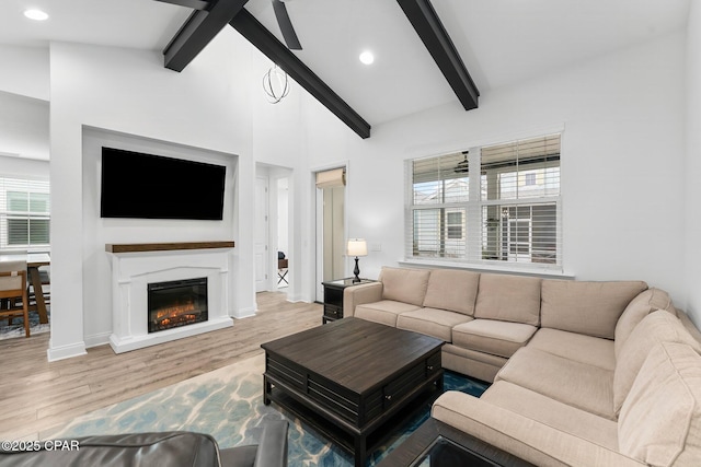 living room with recessed lighting, wood finished floors, and a healthy amount of sunlight