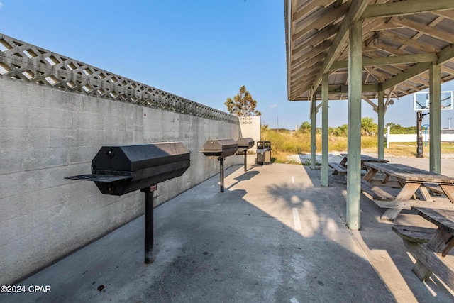 view of patio / terrace with fence, grilling area, and a gazebo