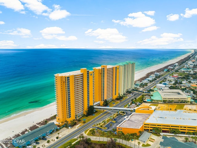 bird's eye view with a water view, a city view, and a beach view