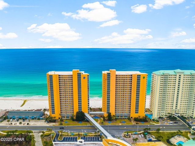 aerial view featuring a beach view, a view of city, and a water view